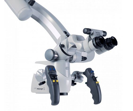 An image of a surgical operating microscope against a white background.