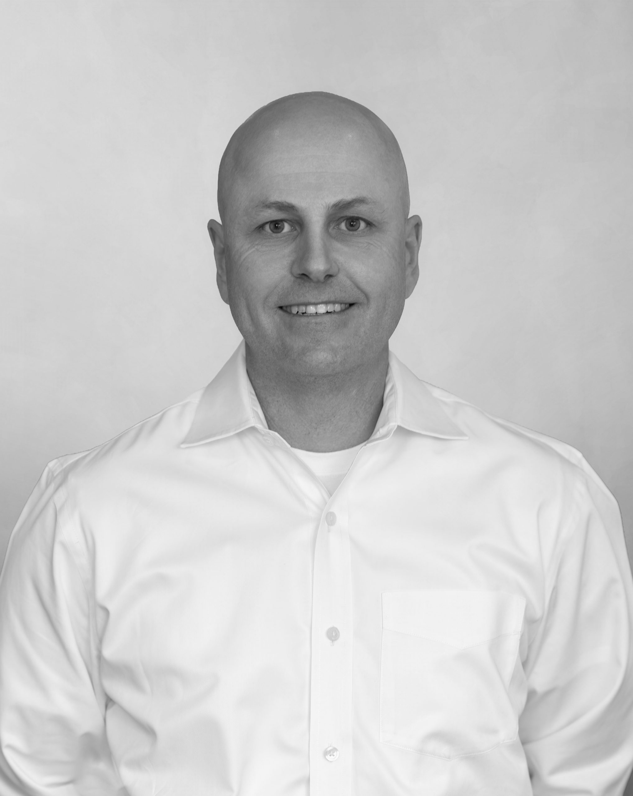 A black and white image of Dr. Michael Trudeau, DDS